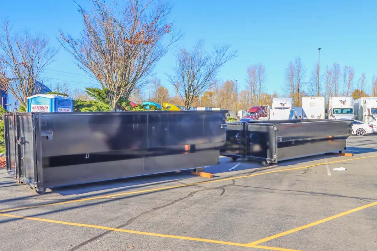 Professional dumpster rental service with roll-off container on residential driveway in Northglenn